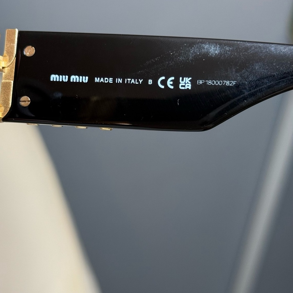 Miu Miu Black Oval Sunglasses with Gold Logo Temples - Picture 4 of 14